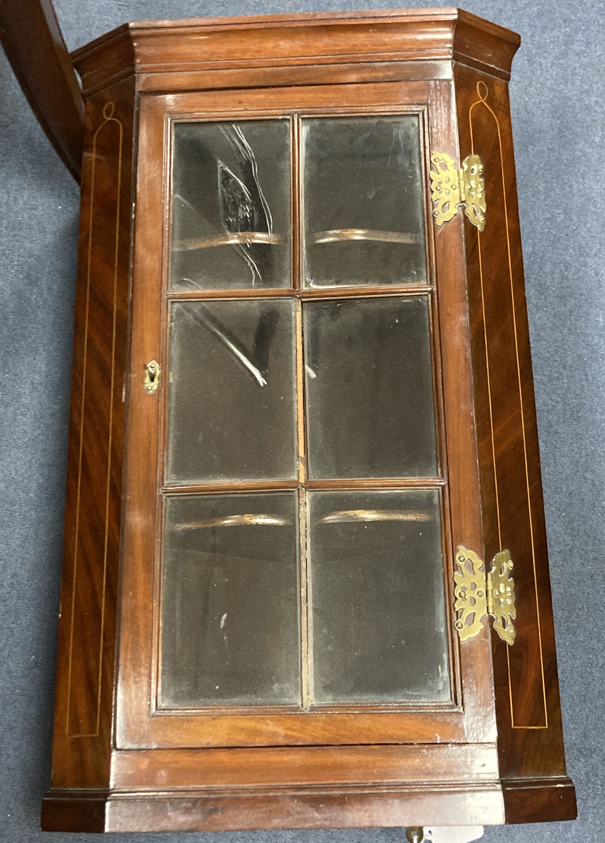 A small George III style mahogany corner cabinet, width 40cm, depth 22cm, height 66cm